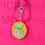 Bolso Munich Bloom Shopper Rosa Fucsia - Detalle colgante Munich Love naranja