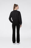 Chándal Champion niña 405461 negro con sudadera y pantalón a juego, vista trasera