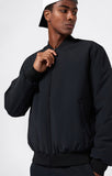 Chaqueta Bomber Champion Negro – Estilo Urbano, Ligera y Deportiva