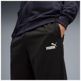 Detalle del logo PUMA blanco y el bolsillo del pantalón del chándal 692630