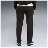 Detalle frontal del pantalón de mujer PUMA TECH W SENSE 694036 negro, con bolsillos laterales