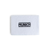 Muñequera Munich 2507143 blanca con inscripción Munich negra