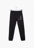 Pantalon niño Losan felpa no perchada con print 113-6025 negro - Puber Sports